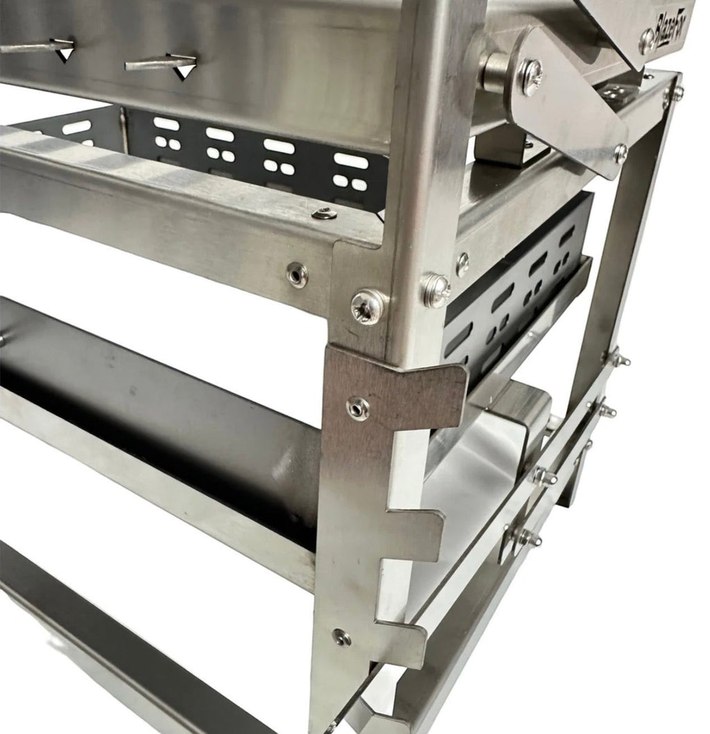 BBQ FIRE stainless steel rotisserie grill with adjustable charcoal height and easy turning mechanism.