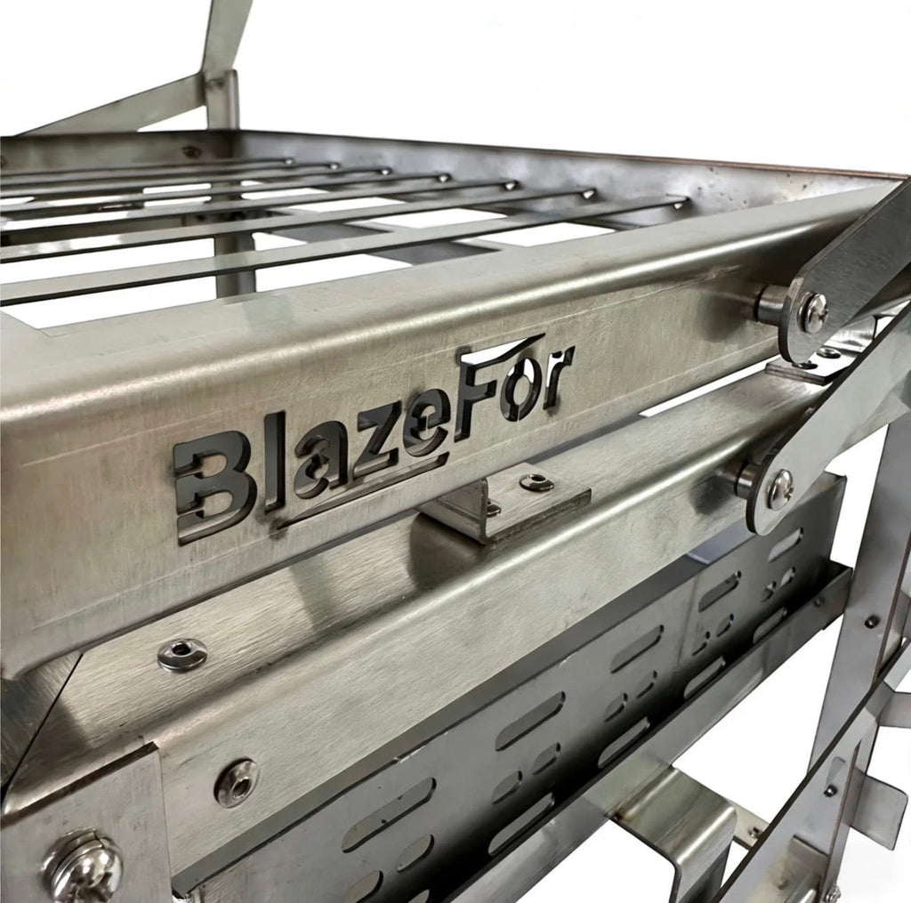 BBQ FIRE stainless steel rotisserie barbecue grill with adjustable height and easy turning mechanism.